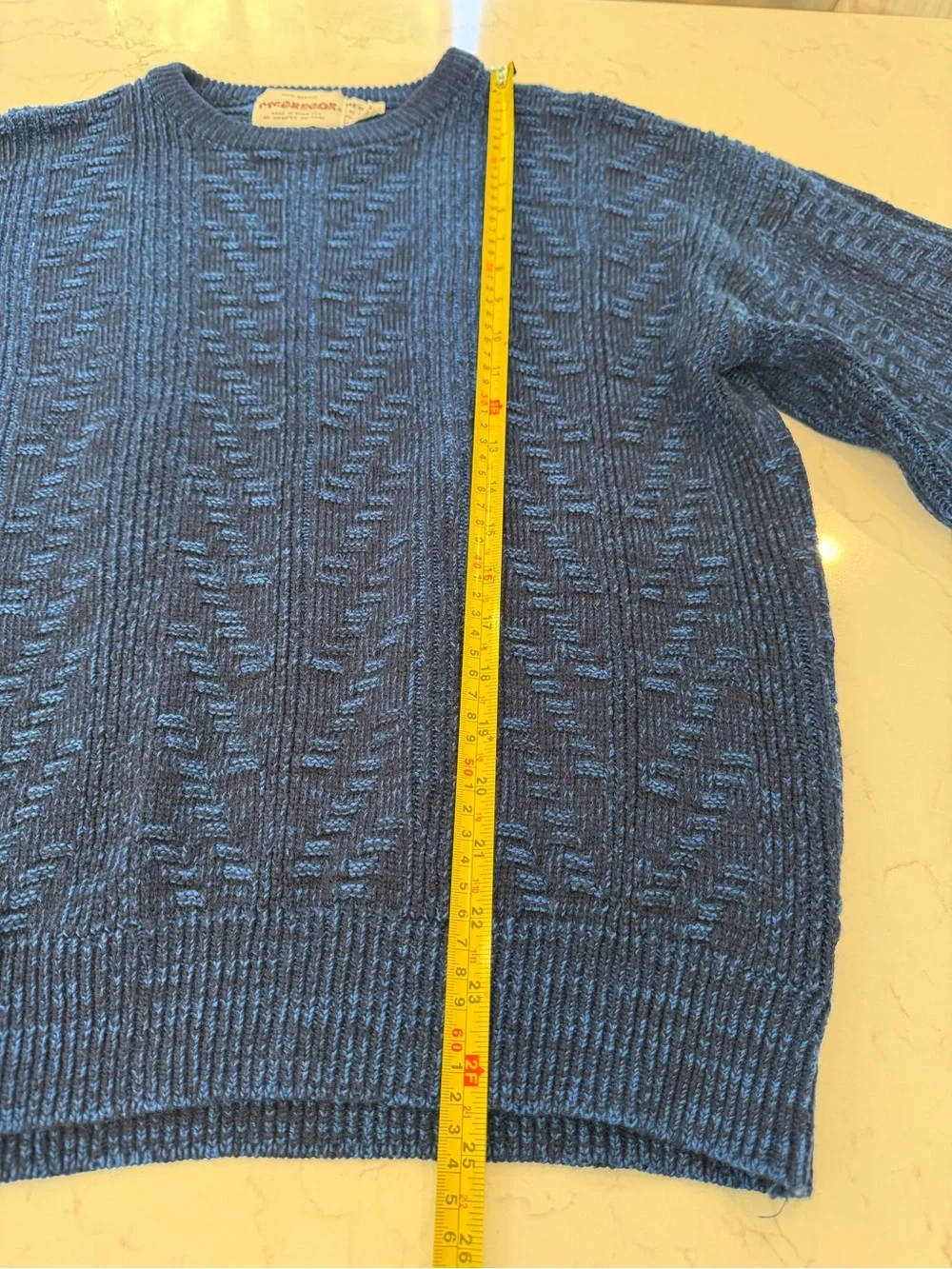 This vintage McGregor blue sweater is made of 100% acrylic